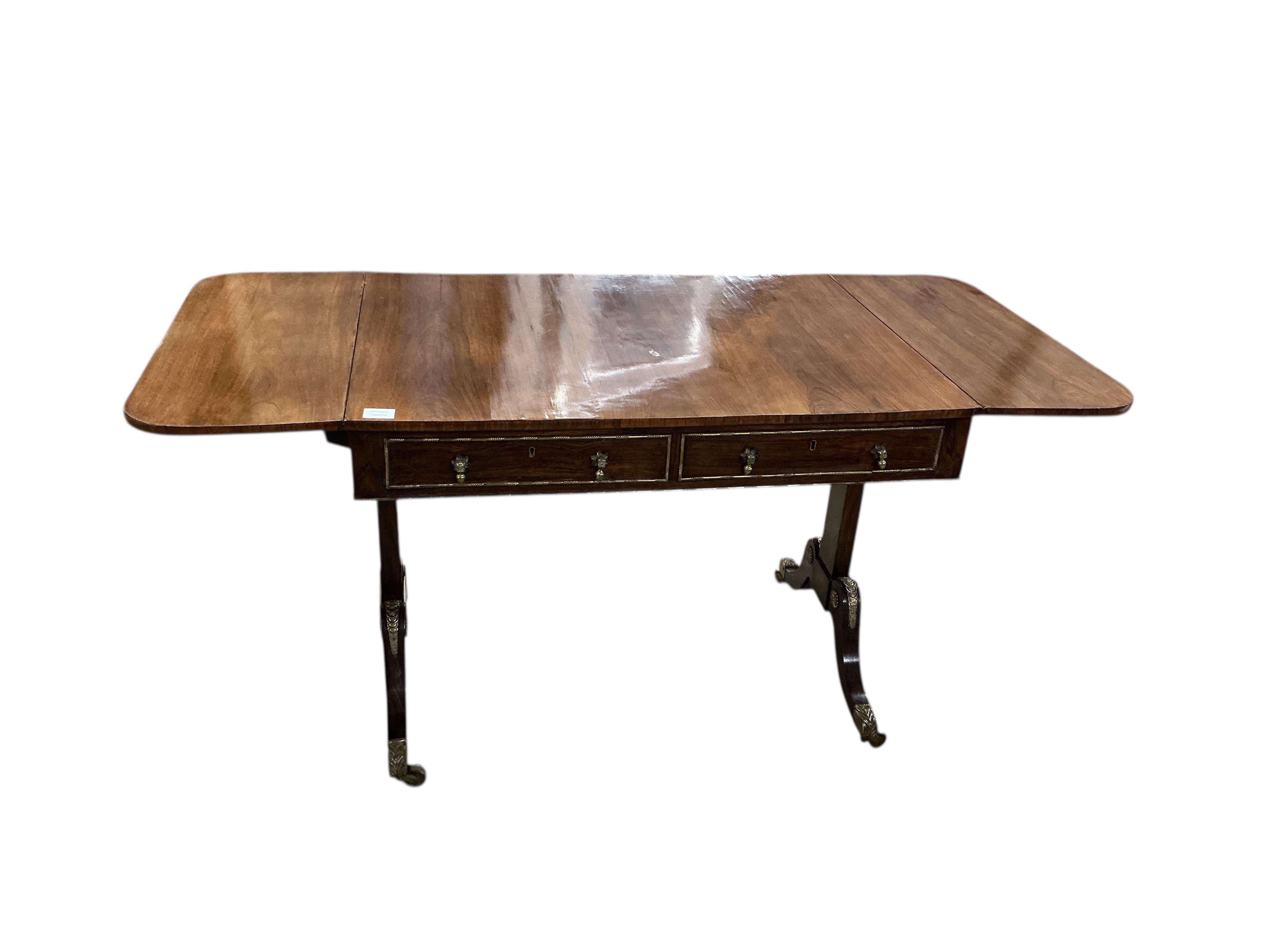 A Regency gilt metal mounted rosewood sofa table, width 94cm, depth 69cm, height 72cm